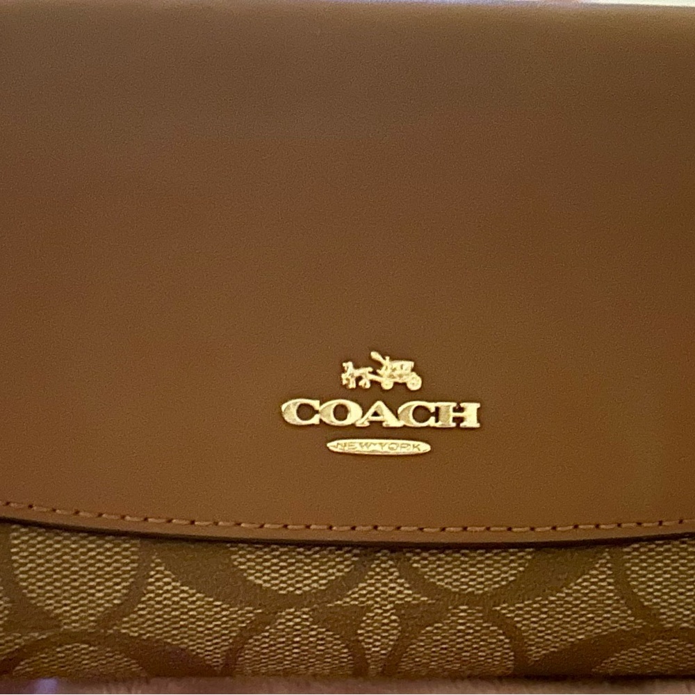 Coach Signature Envelope wallet
signature coated canvas and leather